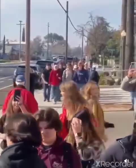 Oakdale high school students march maskless to school to protest mandates