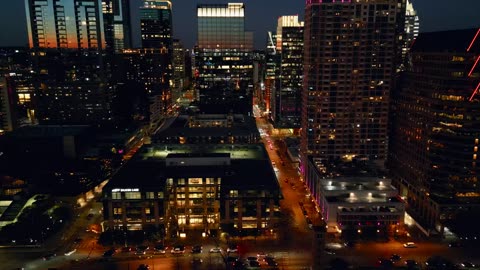 Side by side aerial view of a city at night