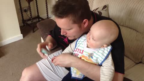 Giggling Baby as nails are cut