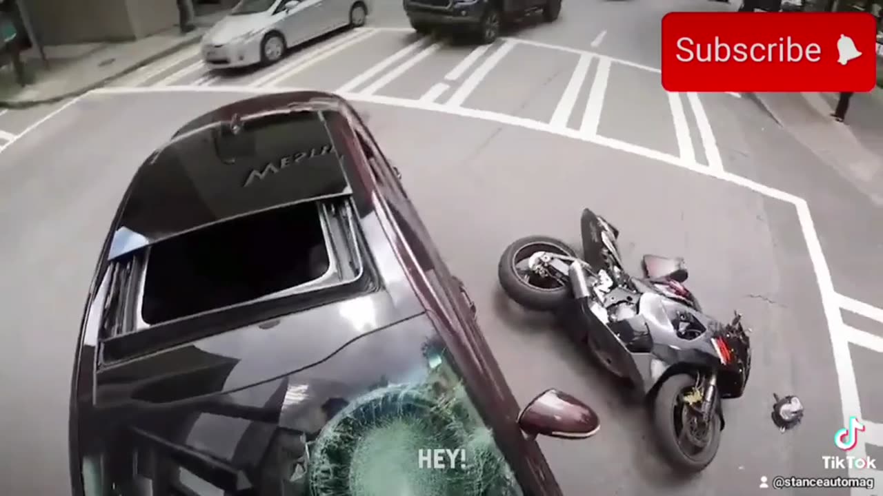 Motorcyclest Smashes Drivers Car Window