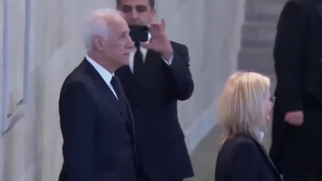 Armenian president takes picture in front of Queen's coffin