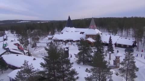 Santa Claus Village in Rovaniemi Finland by air home of Father Christmas in Lapland drone video