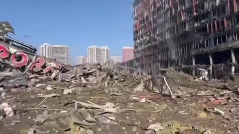 A burned-out shopping center which was being used as ammunition depot for self-propelled guns 2S7 "Pion" in Kiev