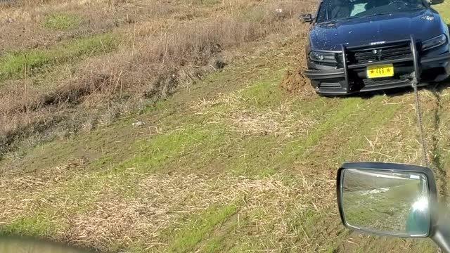 Semi Helps Trooper Trapped in Muddy Median