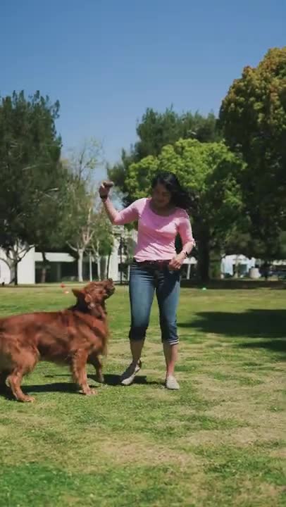.Woman Playing with a Dog