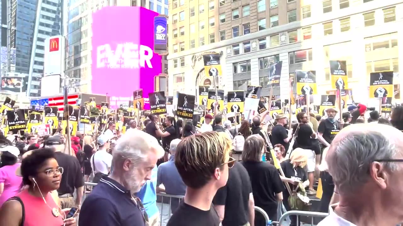 Striking writers and actors rally in New York's Times Square