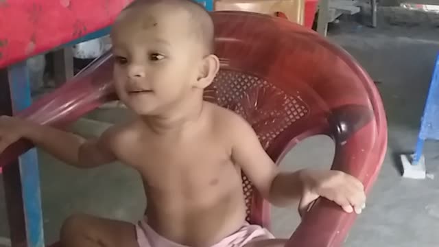 The child is dancing to the beat of the song || The child loves to listen to music.