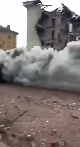 Russian BMP rolls through Bakhmut while on fire