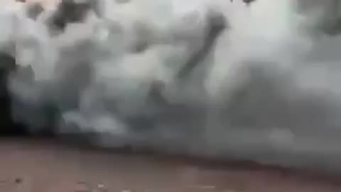 Russian BMP rolls through Bakhmut while on fire