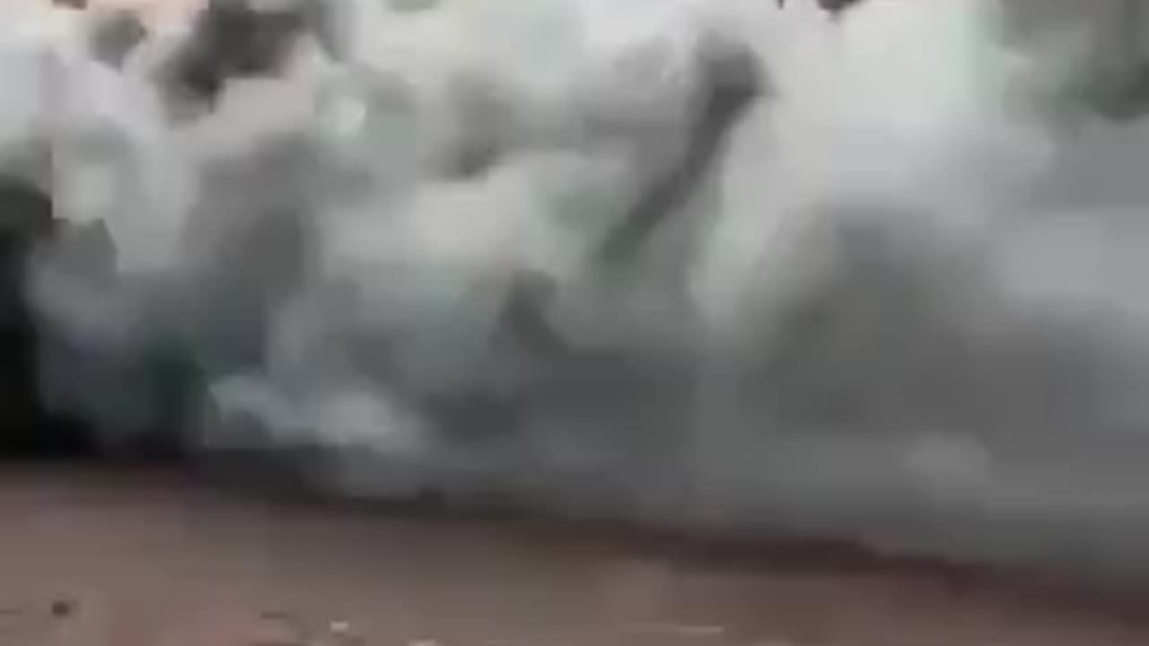 Russian BMP rolls through Bakhmut while on fire