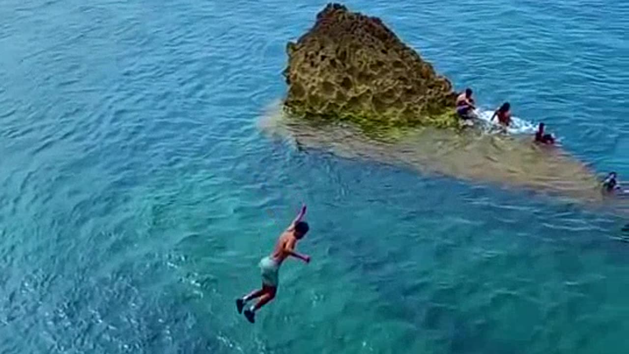swimming jumping in ocean ......
