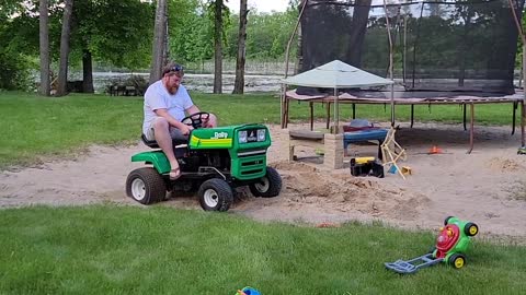 Husband Goofing off on Lawnmower Ends up Dragging Behind it