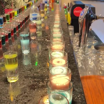 Rows of Colorful Drinks Expertly Mixed