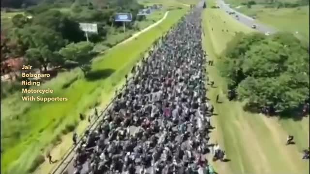 Jair Bolsonaro Rides Motorcycle with His Supporters.