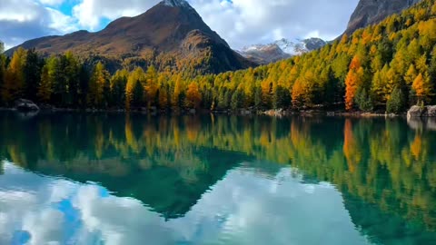 🌊🏔️ "Nature’s Symphony: Where Mountains Kiss the Sky and Waters Reflect Serenity." 🌄✨