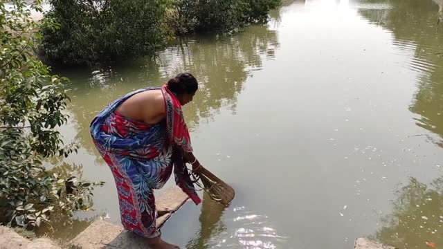 Cast Net Fishing Village Woman Catching Fish With A Cast Net By Beautiful Nature