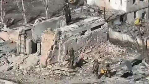 Some Wagner fighters place their flag on a building in central Bakhmut, March 3th