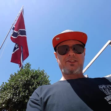 Standing underneath the big old Dixie flag y'all