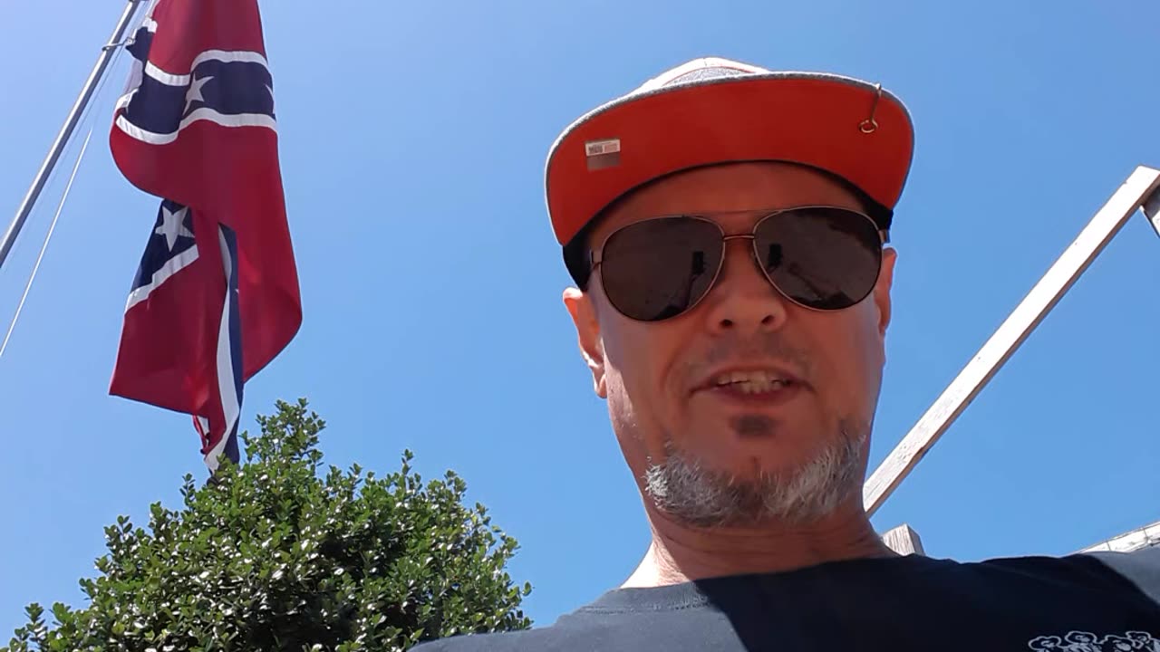 Standing underneath the big old Dixie flag y'all