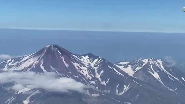 A beautiful mountain range capped in snow as seen from a plane..❄️☃️✈️