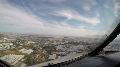 Window view landing on Antalya's runway 18C