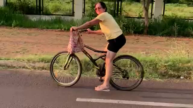 Mom Stopping Bike Falls Off of it