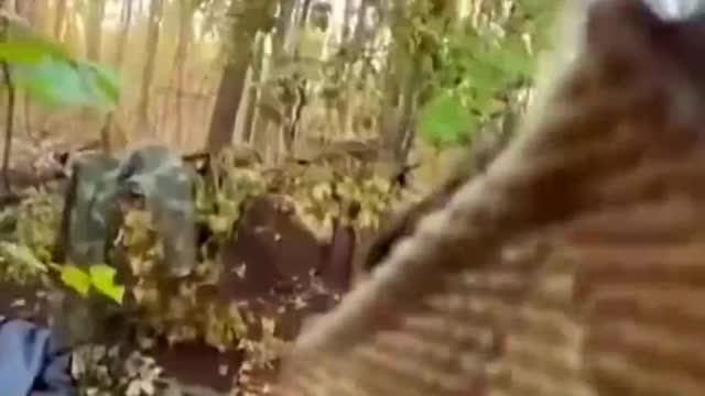 Russian soldier hiding in sleeping bag and pretending to sleep busted
