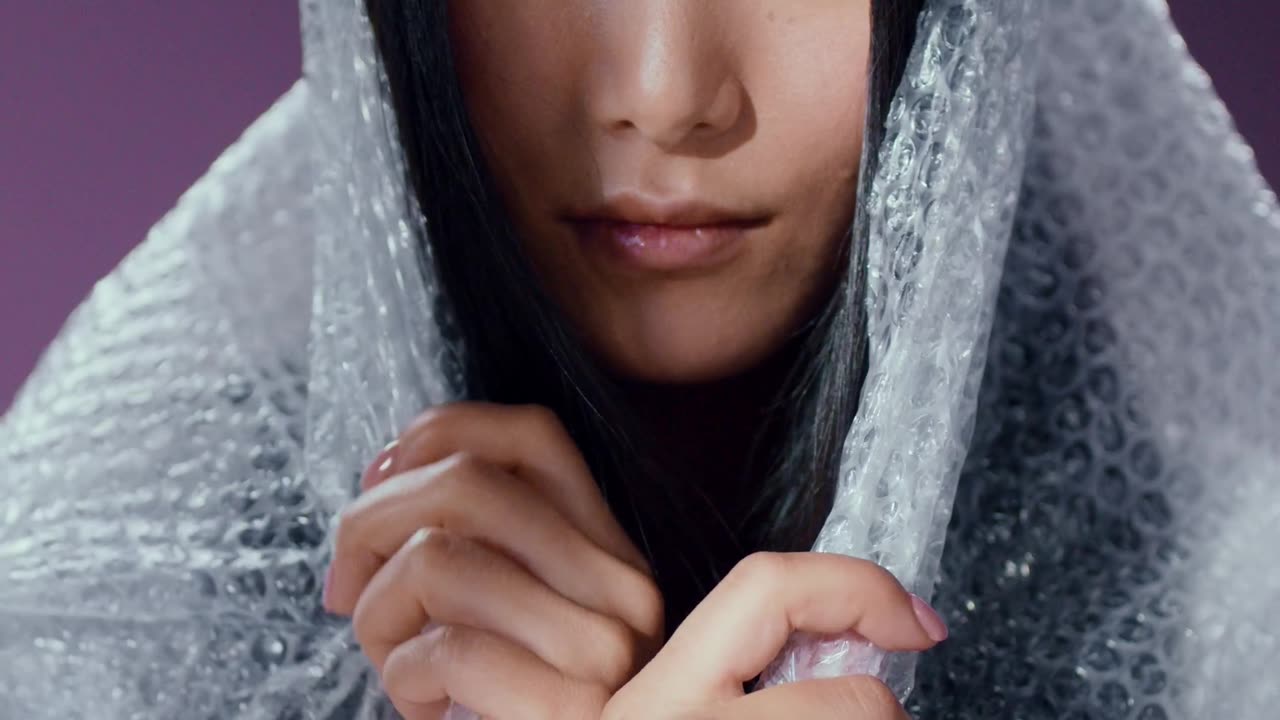 A Woman Popping the Bubble Wrap