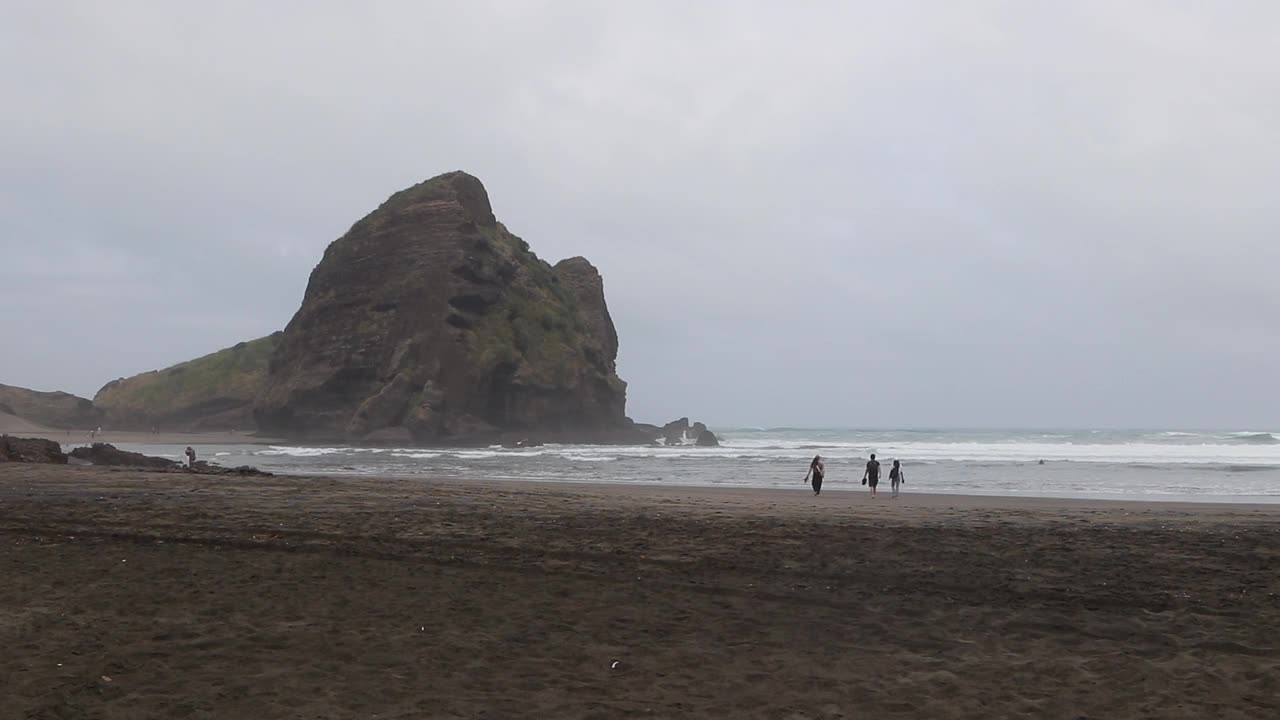 People Enjoy Hot Day on Beach