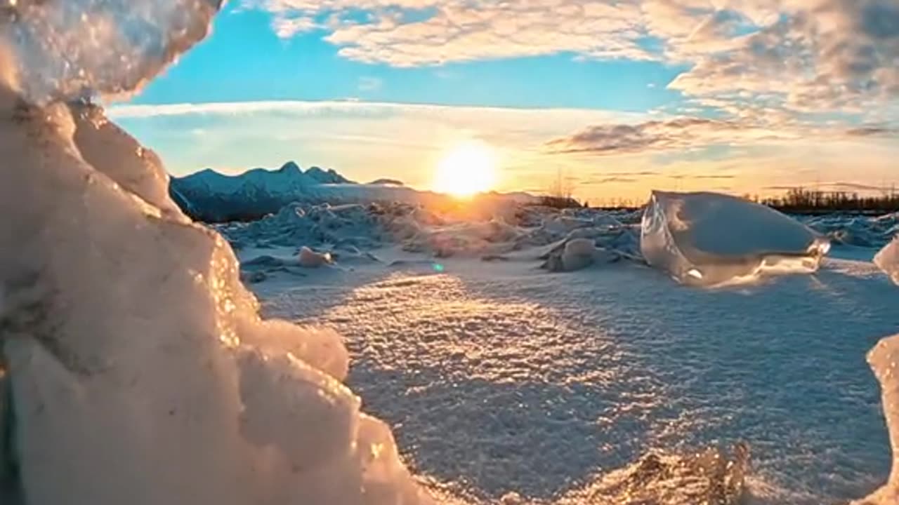 When the sunset shines on ice river spines