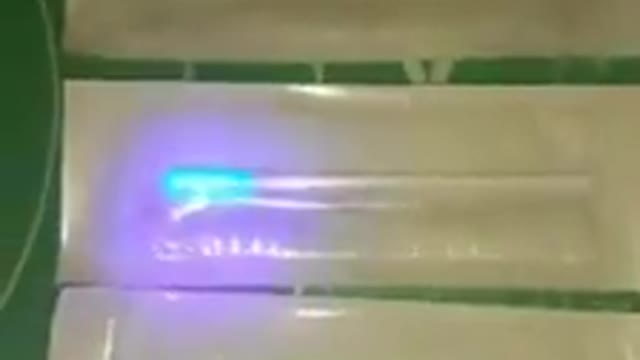 What would make these covid test swabs glow like this under UV light?