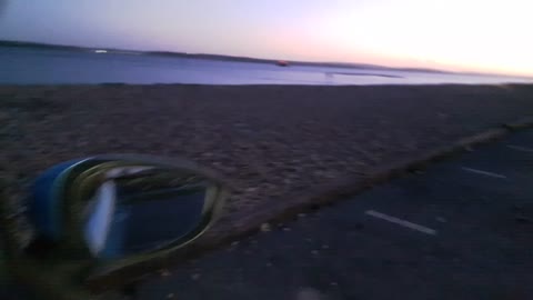 Sunset at a beach. Coffee in a car