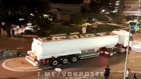 Rioters stole a truck with fuel at night in the suburbs of Paris, France