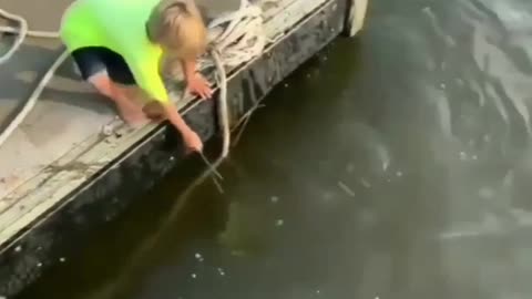 Baby fisher catch a fish