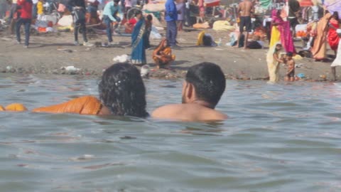 Swimming in ganga river by Indian couple