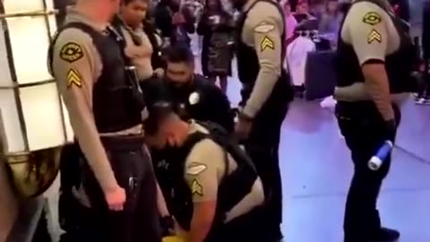 Arrested for flying kick at police officer.