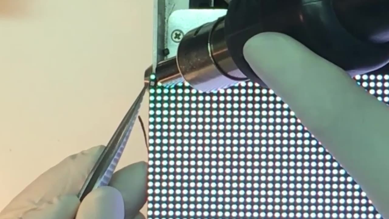 Professional technicians are repairing damaged LED modules