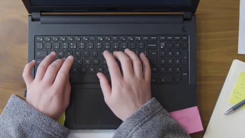 Overhead Male in Dressing Gown Picks Up Laptop