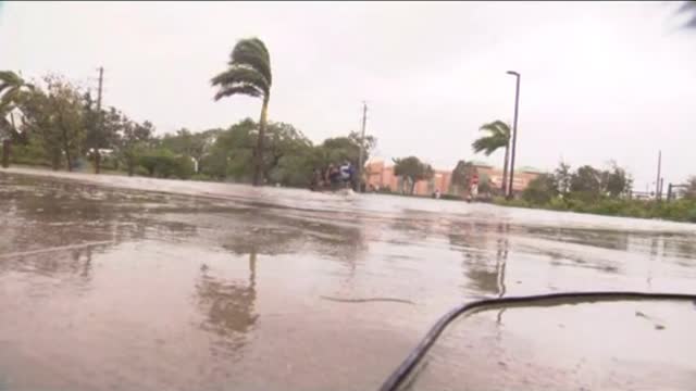 Moment Sunrise cameraman drops camera to rescue families stuck in Hurricane lan