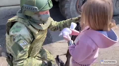 A Little girl from Donbass shows her support for Russian soldiers