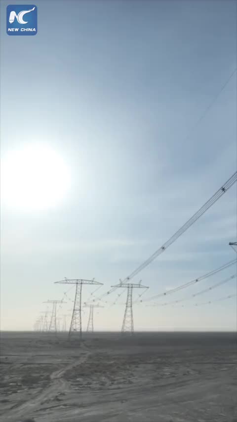 In the Gobi Desert of northwest China's Gansu Province, electricians climbed up to nearly 100 me.