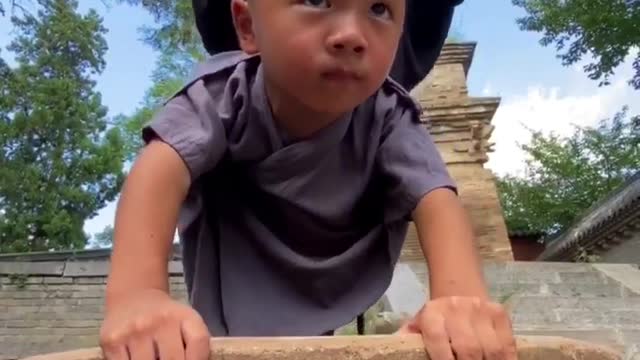 Shaolin monks practice handstand