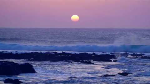 The waves of the sea and the sunset