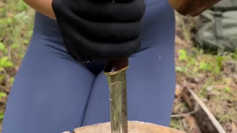 Cute girl cut tree for fire