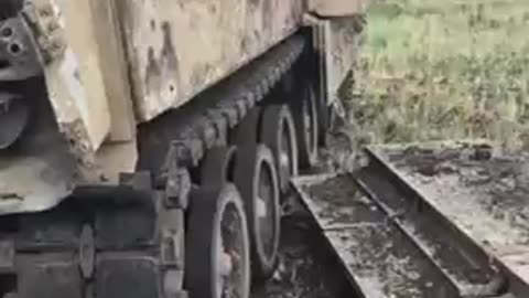 Russian soldier checking out abandoned Bradley Avdeevka direction