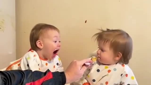 cute baby fighting over food