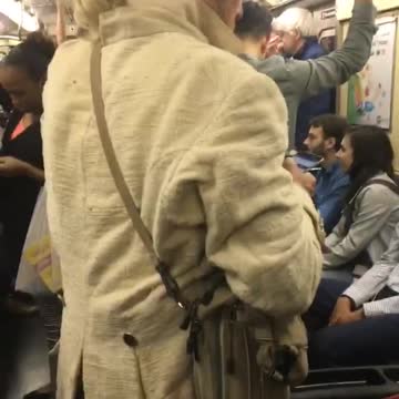 Man in old time clothes and wig