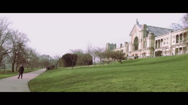 Woman walking through a park_