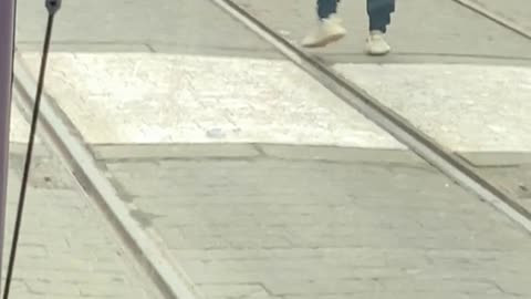 A group of men fighting on railways