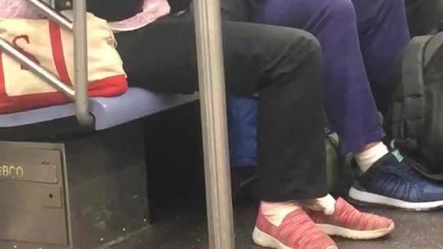 "a new york valentine" woman gives foot massage to her girlfriend on subway train